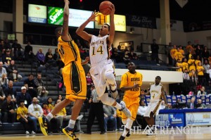 Sophomore guard Damion Lee goes for a layup against george Mason. Lee scored 16 points in the loss.