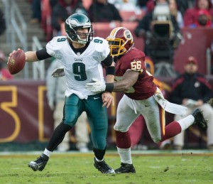 Philadelphia Eagles quarterback Nick Foles is chased and sacked by Washington Redskins inside linebacker Perry Riley at FedEx Field in Landover, Md., Nov. 18, 2012.