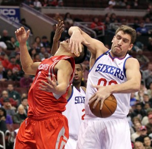 Spencer Hawes of the Philadelphia 76ers steals the ball from Jeremy Lin of the Houston Rockets during the fourth quarter at the Wells Fargo Center in Philadelphia on Nov. 13. The Sixers won in overtime, 123-117.