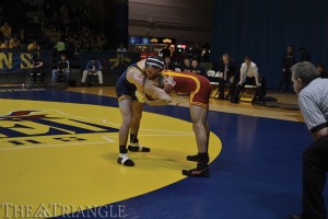 Junior 149-pounder Shane Fenningham matches up against Max Mayfield of Iowa State University last season at the DAC. Fenningham won in a 5-3 decision.