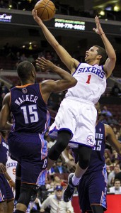 Philadelphia 76ers point guard Michael Carter-Williams shoots over Charlotte Bobcats point guard Kemba Walker during the first quarter in Philadelphia Jan. 15.