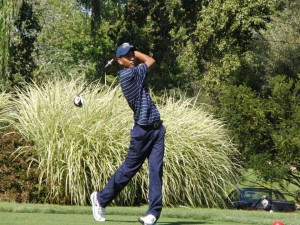 Freshman golfer Yoseph Dance watches a shot at the Cornell Invitational September 22. Dance finished tied for 25th at the Navy Spring Invitational April 20.