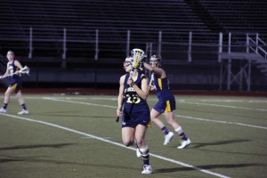 Senior midfielder Amanda Norcini is pictured here against La Salle March 12. The Dragons won April 6 against Towson, 9-8, with Norcini contributing four assists. (Ajon Brodie)