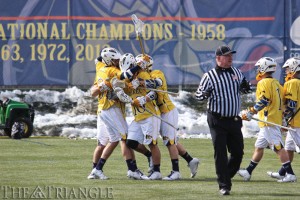 Miranda Shroyer The Triangle The men’s lacrosse team celebrates a goal versus Robert Morris University March 1 at Vidas Field. The team topped Towson at home, 11-10, in overtime May 1 to advance to the CAA Championship game versus Hofstra University for an automatic bid to the NCAA Tournament. 