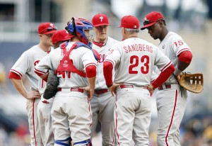 Philadelphia Phillies manager Ryne Sandberg (23) talks with relief pitcher Jake Diekman (middle) and the Phillies infield against the Pittsburgh Pirates during the eighth inning at PNC Park. The Pirates won 6-2. (Charles LeClaire - USA Today Sports)