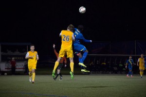Senior defender Maty Brennan goes up to defend an incoming University of Delaware header. Defense would end up being the undoing of the Dragons in the game, which they lost 4-0. (Ajon Brodie - The Triangle)