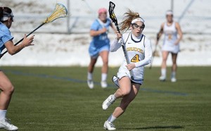 Lacey Aghazarian pushes the ball up the field. Aghazarian, a sophomore midfielder from Maryland, netted 3 goals in the Dragons’ 17-10 loss to the University of Maryland, Baltimore County. (Photo Courtesy - Drexeldragons.com)
