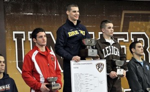 Kevin Devoy Jr. stands on the podium as the champion in the 133-pound division at the EIWA Championships. (Photo Courtesy - Drexeldragons.com)