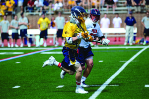 Junior midfielder Hank Brown rushes downfield against the University of Pennsylvania May 11, 2014, in the first round of the 2014 NCAA tournament. (Ken Chaney - The Triangle)