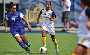 Freshman midfielder Vanessa Kara dribbles by a defender. She leads the team in goals scored and overall points with seven and sixteen, respectively. She also has two assists in eleven starts. (Photo Courtesy - Drexeldragons.com)