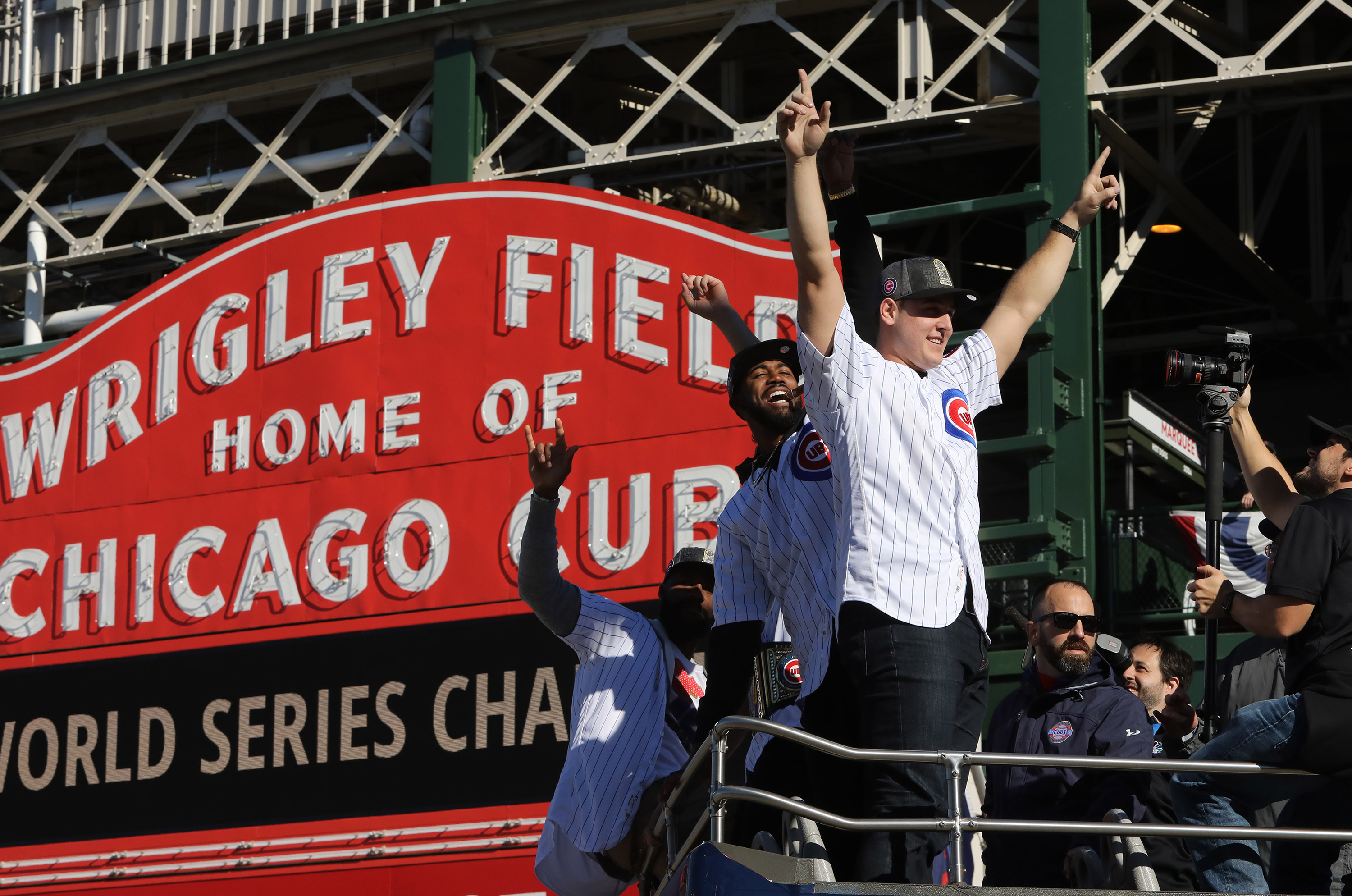 Chicago Cubs Anthony Rizzo along with teammates family, staff and friends roll pass in a double decker bus past the iconic Wrigley Field Chicago Cubs marque during the parade honoring the World Series Champion Chicago Cubs, Friday, Nov. 4, 2016. (Antonio Perez/Chicago Tribune/TNS)